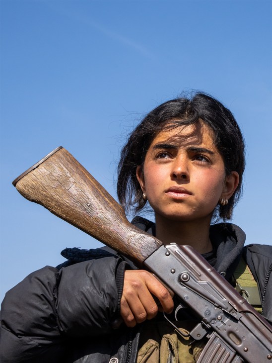 Kurdish fighter during military training exercises