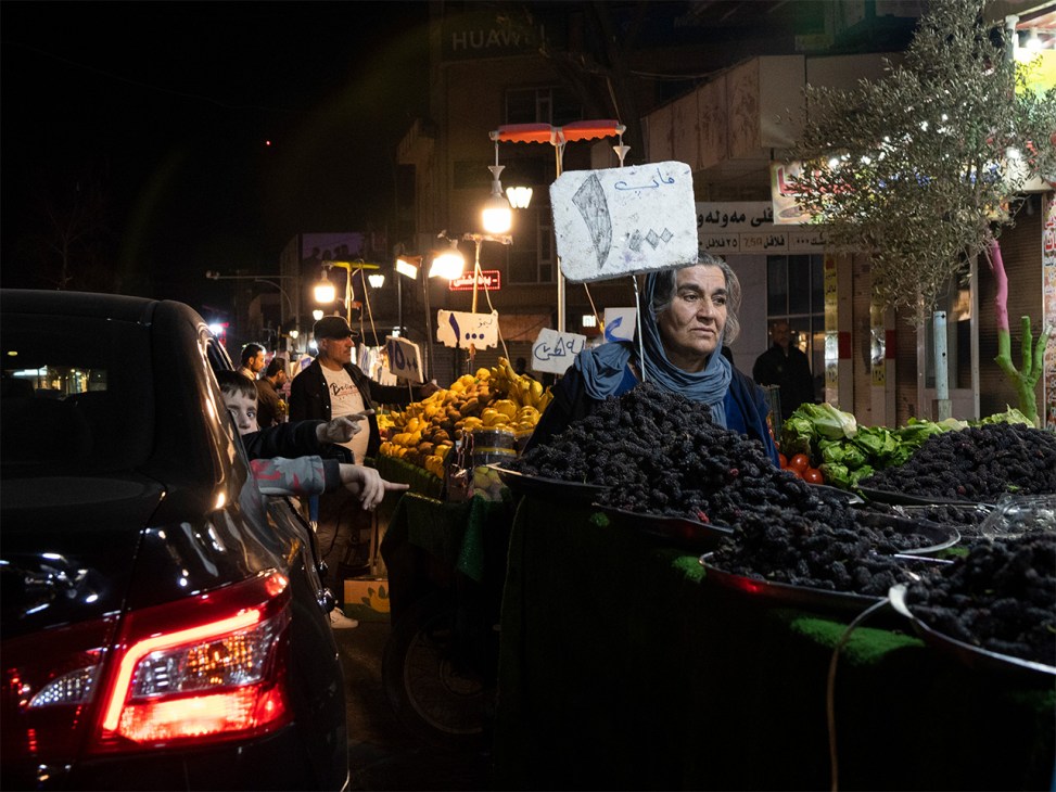 Busy night market scene in Sulaymaniyah with vendors and shoppers