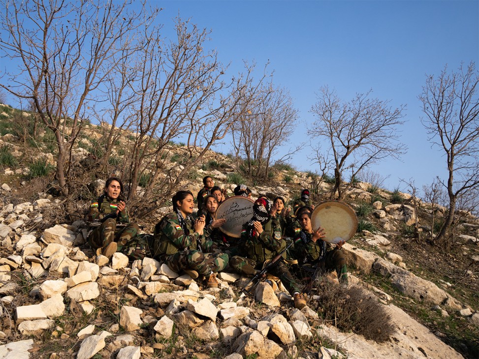 Group of PAK women's battalion members singing together