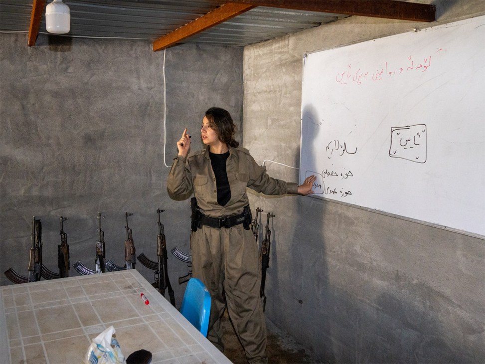 Kawsar Fattahi standing and teaching a political ideology class to recruits