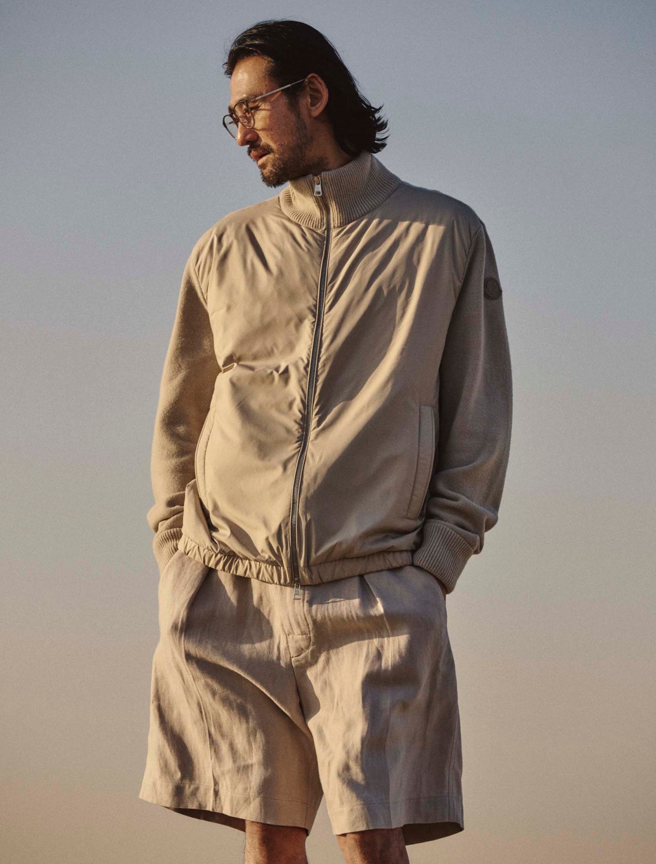 Jacket by Moncler, shorts by Loro Piana, glasses by Mykita