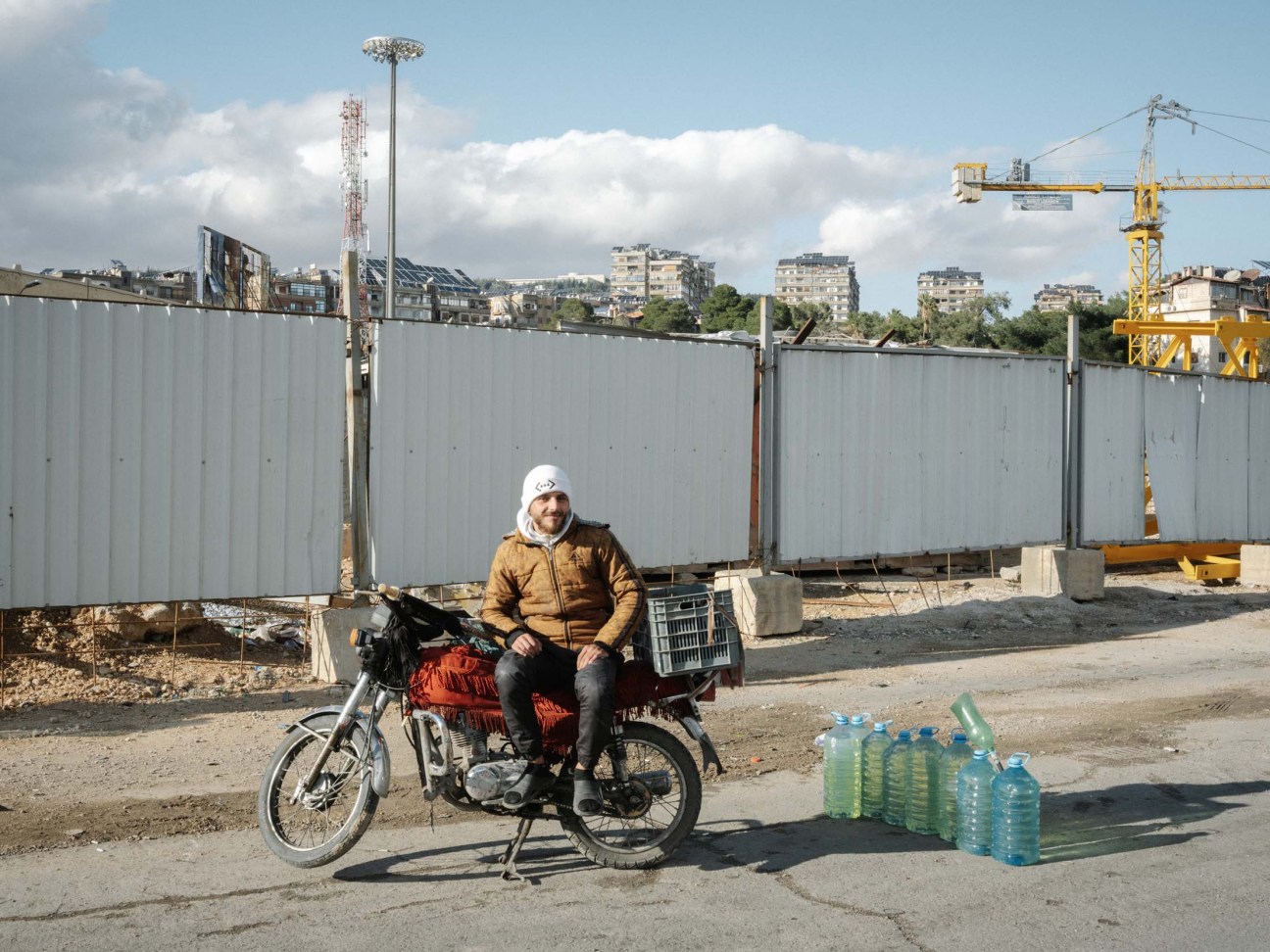 Syria, Damascus, 2025. A view of hawkers selling oil on the side of the road as people struggle to access petroleum products due to the sanctions imposed on the country.