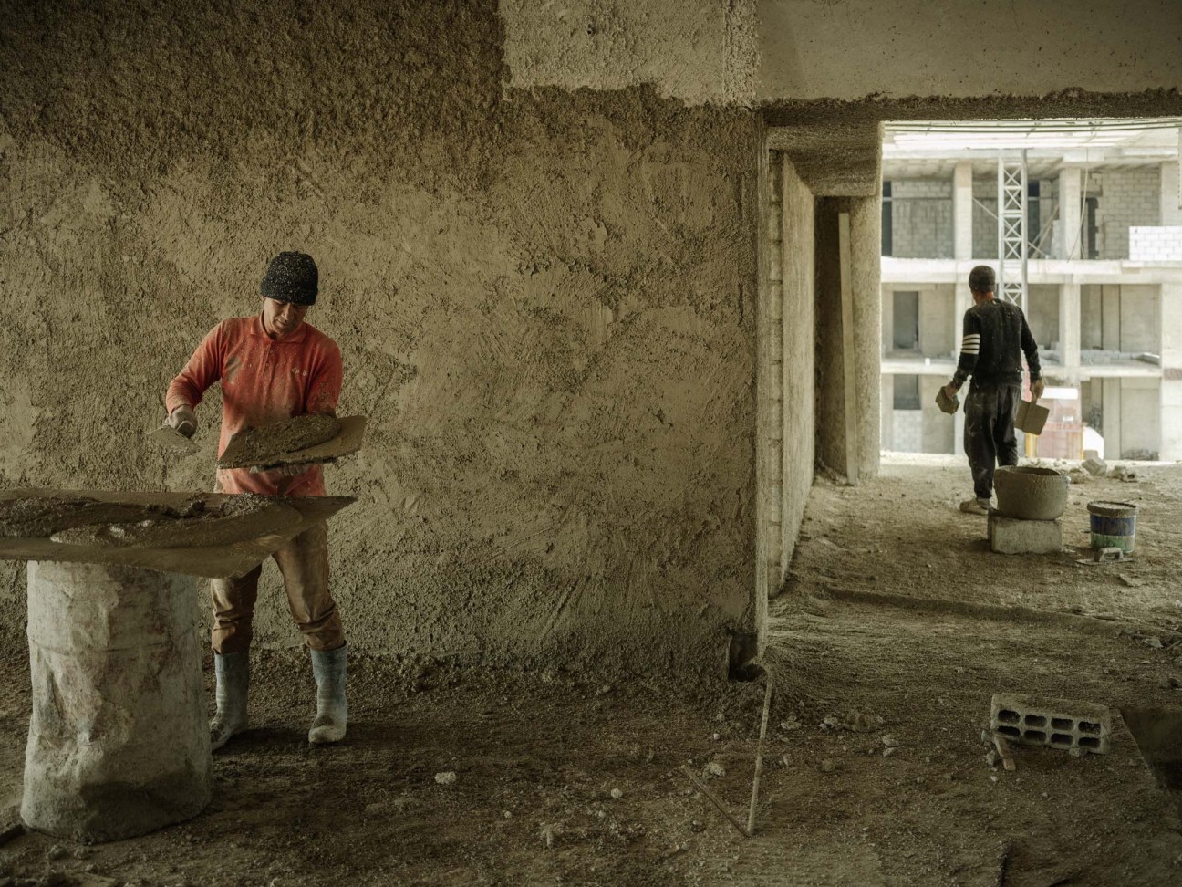 Syria, Damascus, 2025. Men work in construction site in Mazzeh district in Damascus.