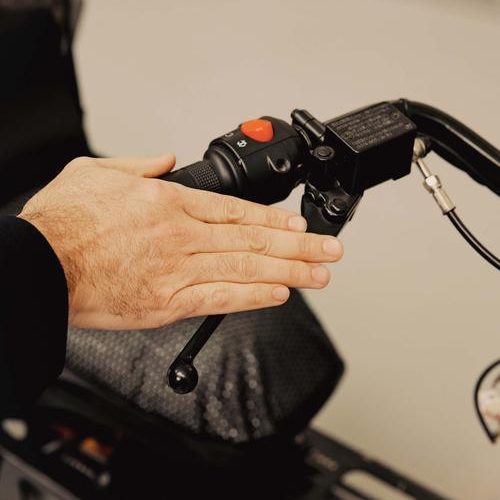 A hand on a handlebar/accelerator. 