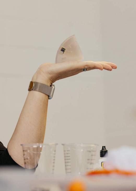 An arm holding a component.