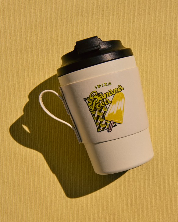 A disposable branded coffee cup