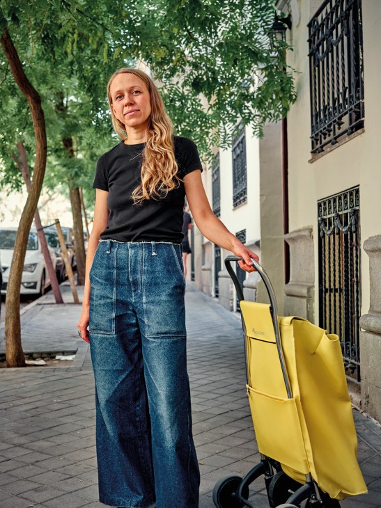 A woman with a Rolser shopping trolley