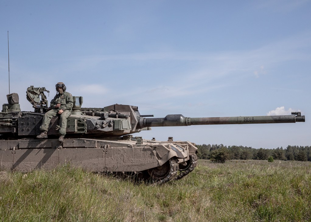 A Polish soldier sits on Poland’s ﬁrst South Korean K2 tank