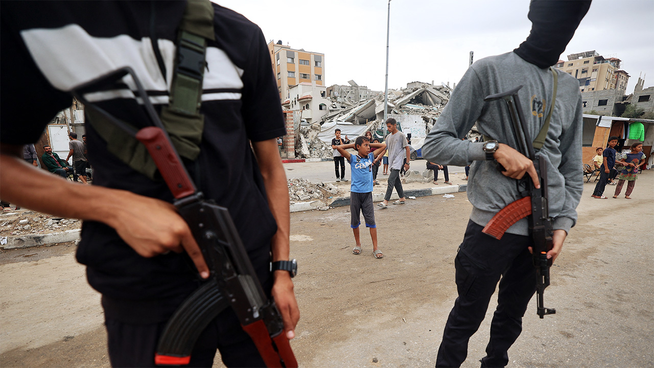 Members of the internal security forces loyal to the Palestinian group Hamas, man a checkpoint in the Nuseirat refugee camp in the central Gaza Strip