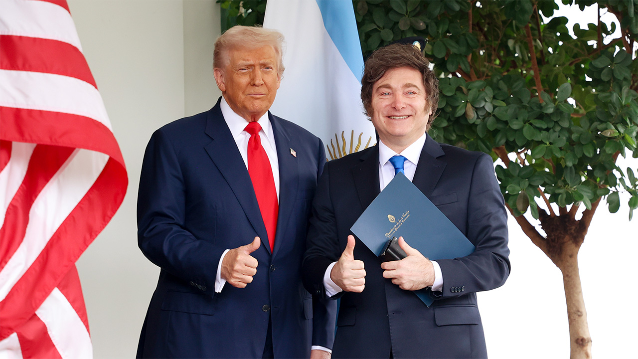 President Donald Trump poses beside Javier Milei