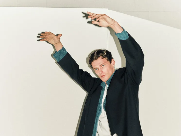 Model wearing a blue navy coat
