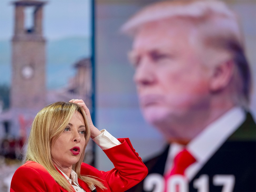 A news broadcast with Donald Trump in the background on a screen