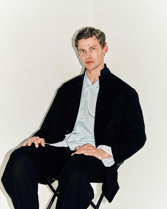 Model wearing jacket, shirt and trousers by Cahlumn