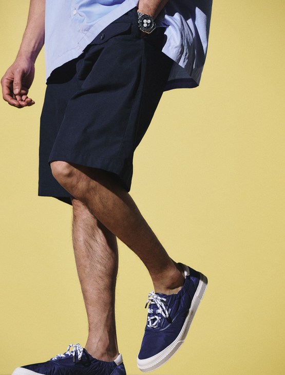 Model wearing Shirt by Cahlumn, shorts by EG Workaday, trainers by Moncler, Speedmaster Moonwatch Professional Watch by Omega