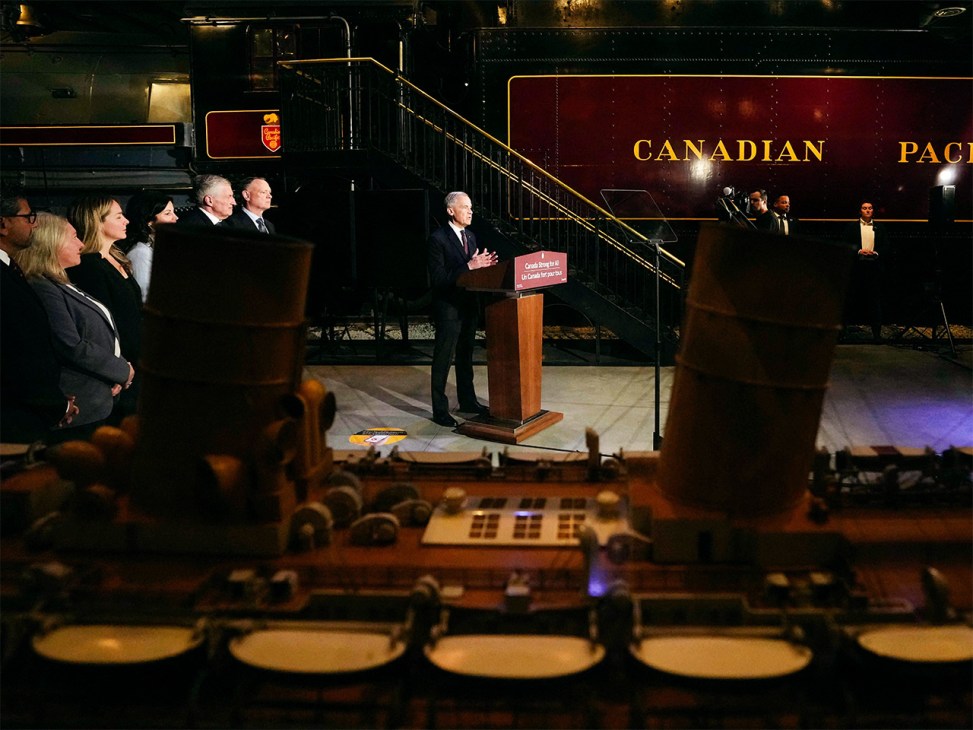 Prime Minister Mark Carney speaks from a lectern beside a Canadian Pacific locomotive at the Canada Science and Technology Museum, during an announcement on the Canada Strong Fund, Canada's first sovereign wealth fund in Ottawa (Image: The Canadian Press/Alamy)