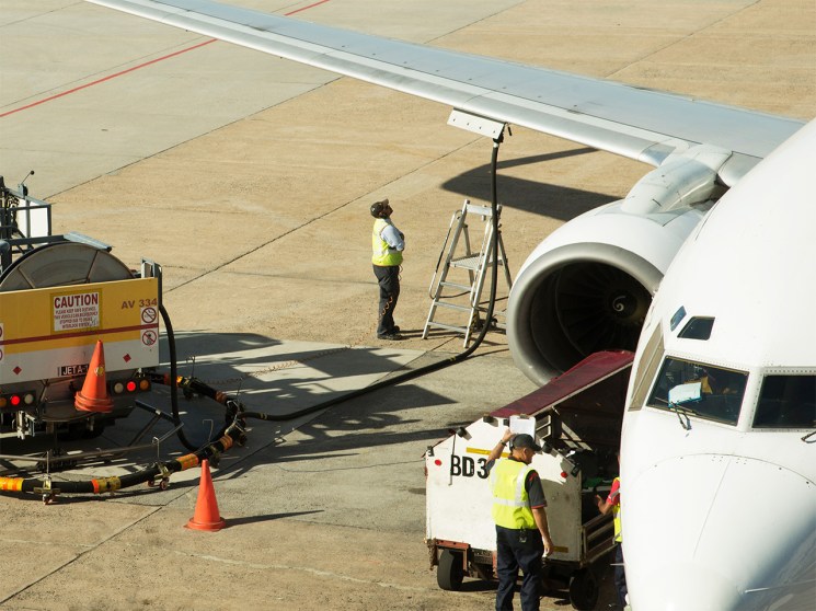 A lack of jet fuel continues to affect the industry - pictured, a plane fuelling up