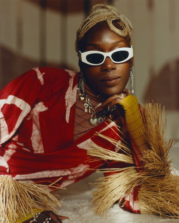 Tanzanian artist Valerie Amani posing in sunglasses