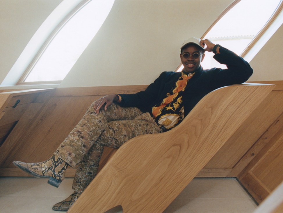 Hugh Hayden leaning on a chair