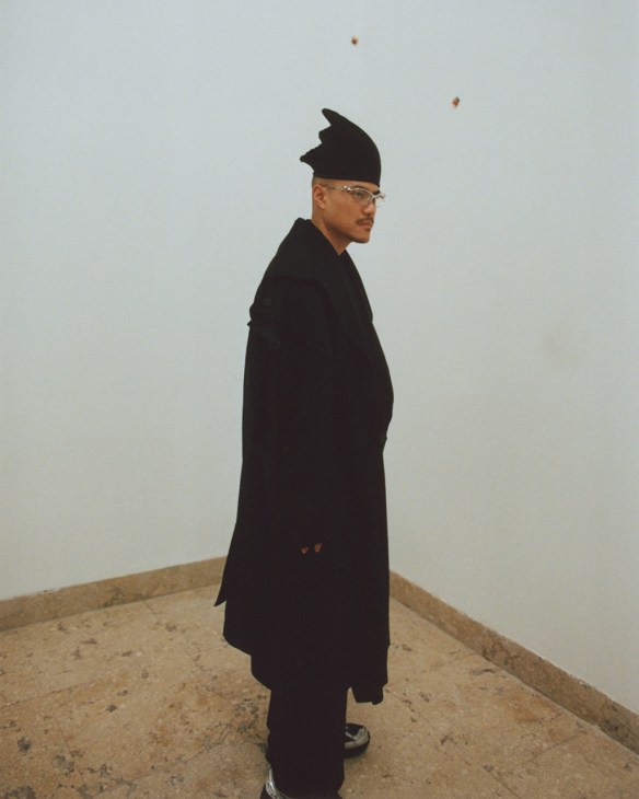 A visitor clad head to toe in Issey Miyake