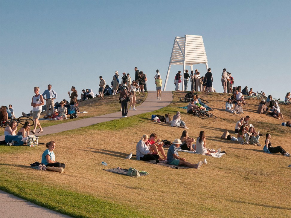 Crowd gathered on a summer evening at Point Ormond Lookout, Melbourne, Australia