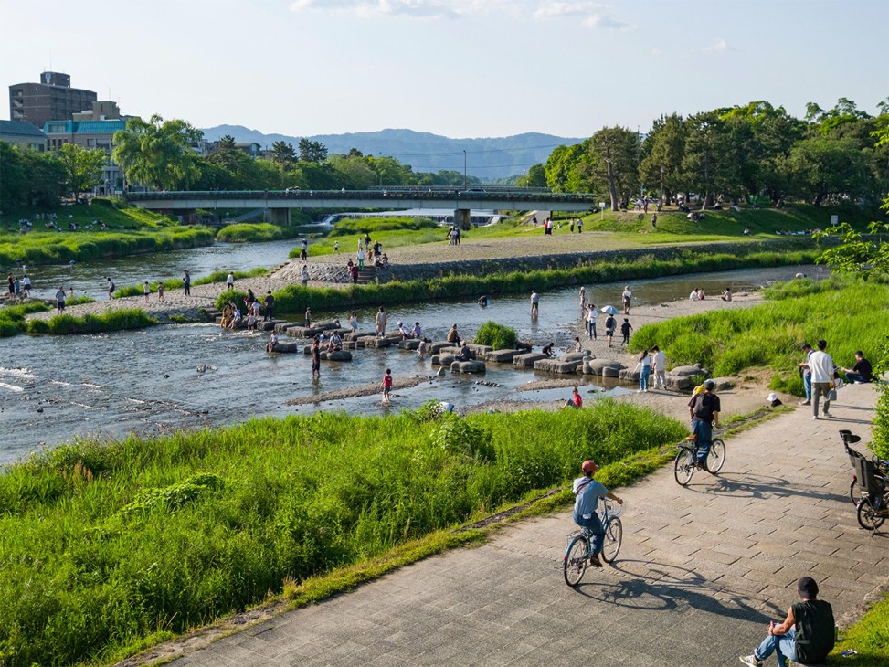 Biking along the Kamogawa in Kyoto Japan