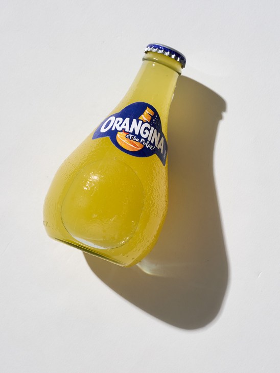 A bottle of Orangina