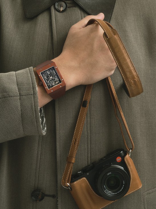 Richard Mille RM 16-02 terracotta watch on wrist with Leica camera and Brioni coat
