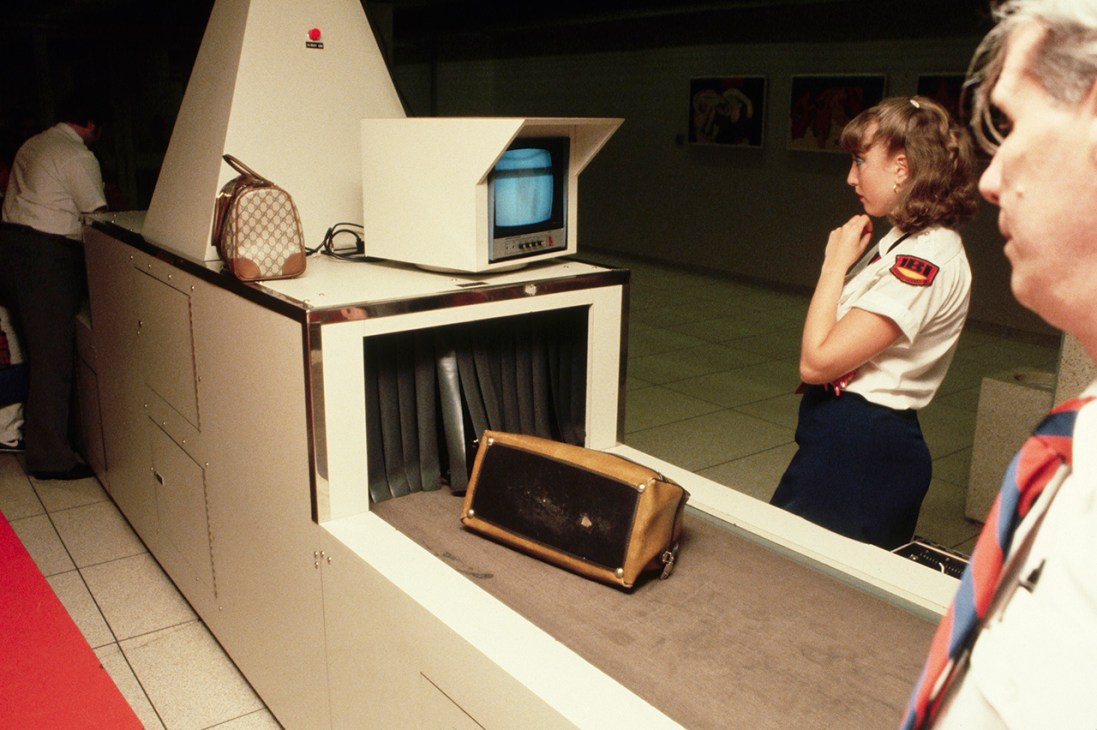 Airport Security Officer Checking Carry-on Luggage (Photo by Jacques M. Chenet/CORBIS/Corbis via Getty Images)