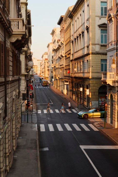 General street with with a Maserati GranCabrio Trofeo driving through