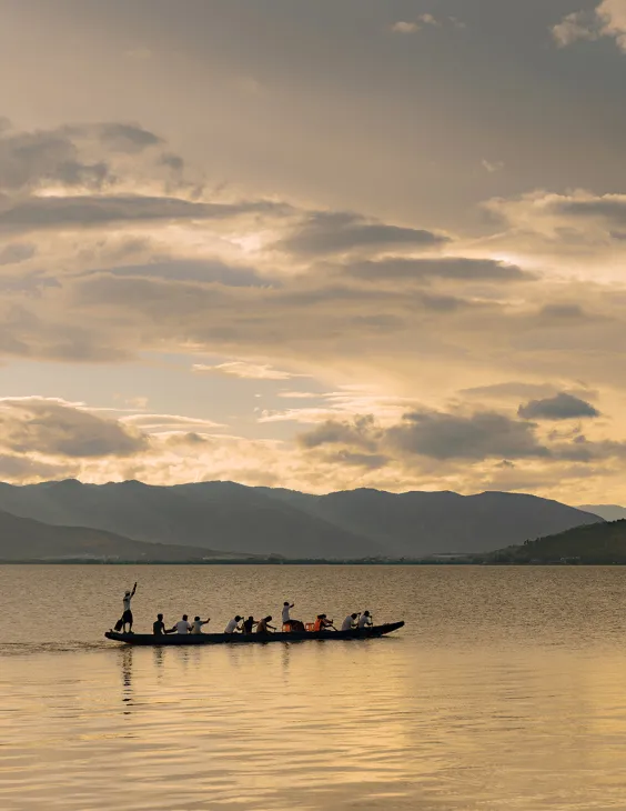 Paddlers on a dragon boat on the Erhai lake