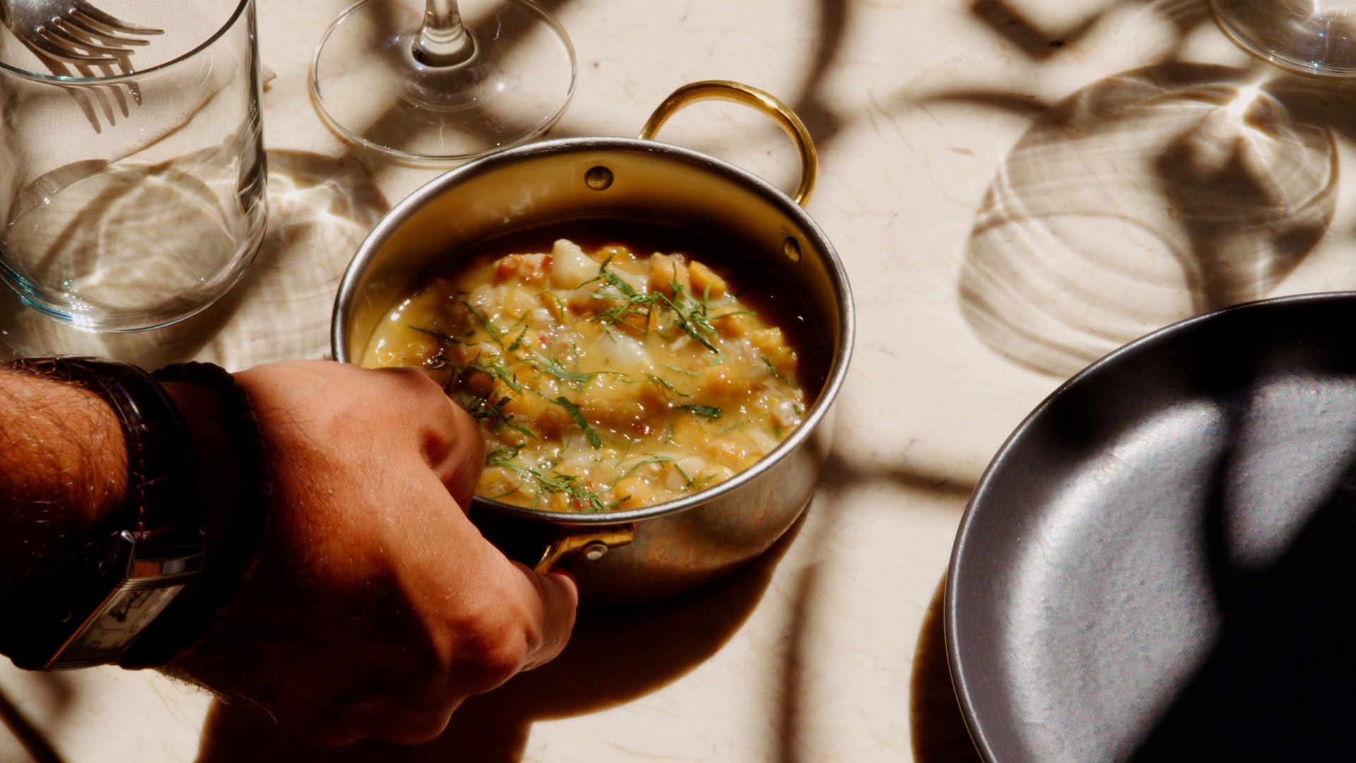 A meal in a pan on a table at a Tasca in Lisbon