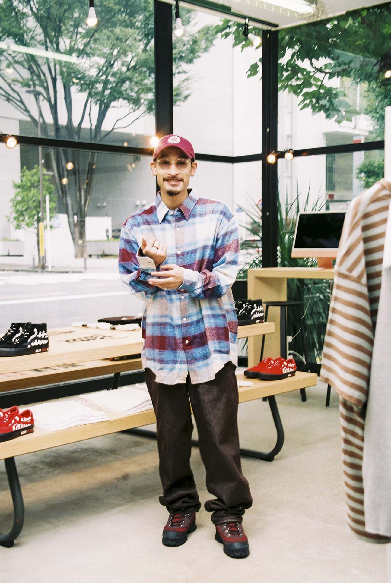 Ryosuke Nozaki wearing Auralee trousers and Noma TD shirt in a Beams store