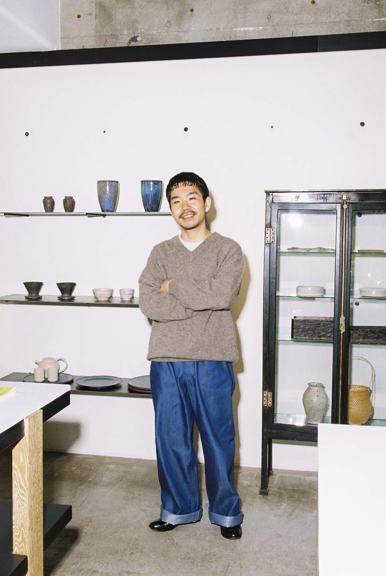 Yasushi Ito in oversized jeans and Italian shoes at Bloom & Branch.