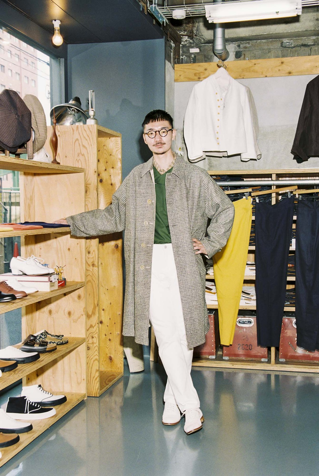 Ryota Yamane wearing Anatomica reversible coat and trousers with vintage Swedish military shirt