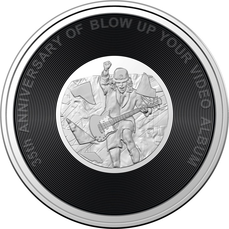 Commemorative coin featuring guitarist with AC/DC album design resembling vinyl record