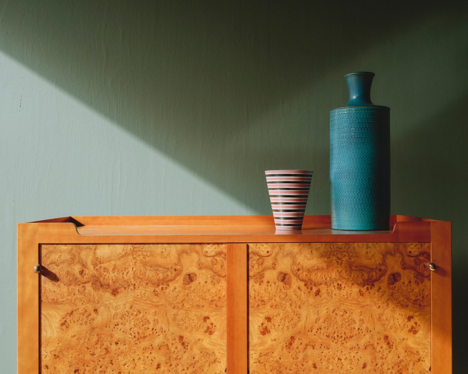 Vases by Stig Lindberg for Gustavsberg displayed on wooden sideboard