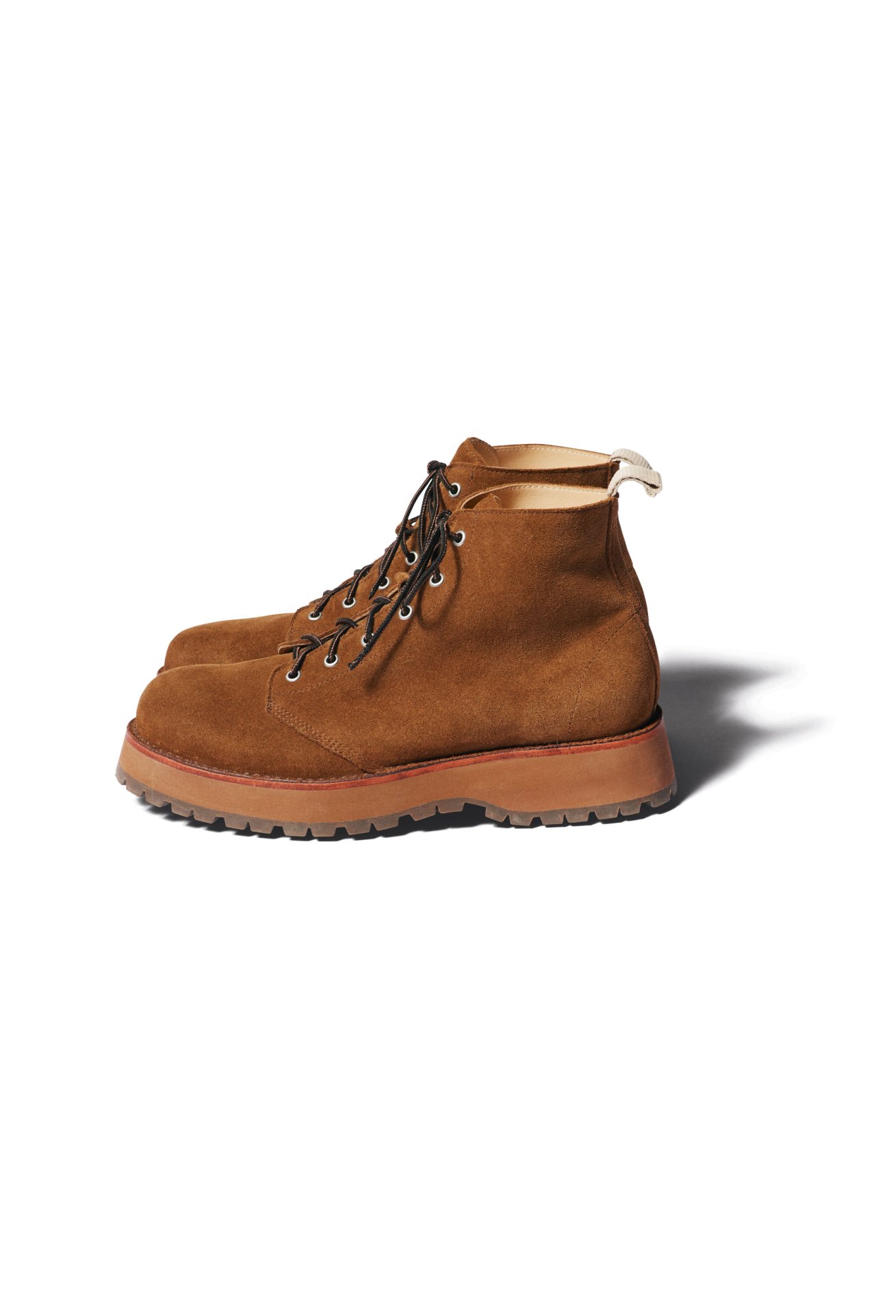 Brown suede lace-up boots by Nonnative with chunky sole and hiking-inspired design