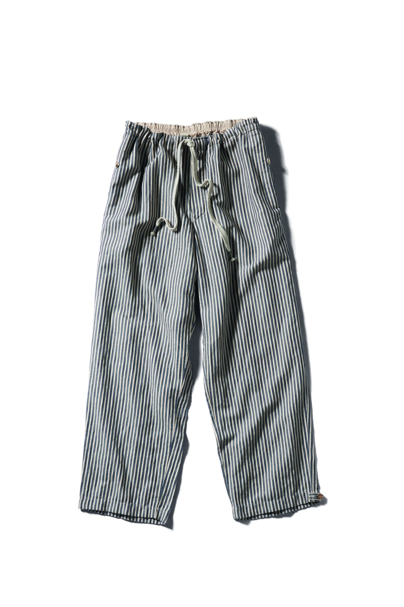 Striped drawstring trousers by Heugn in blue and white vertical stripes