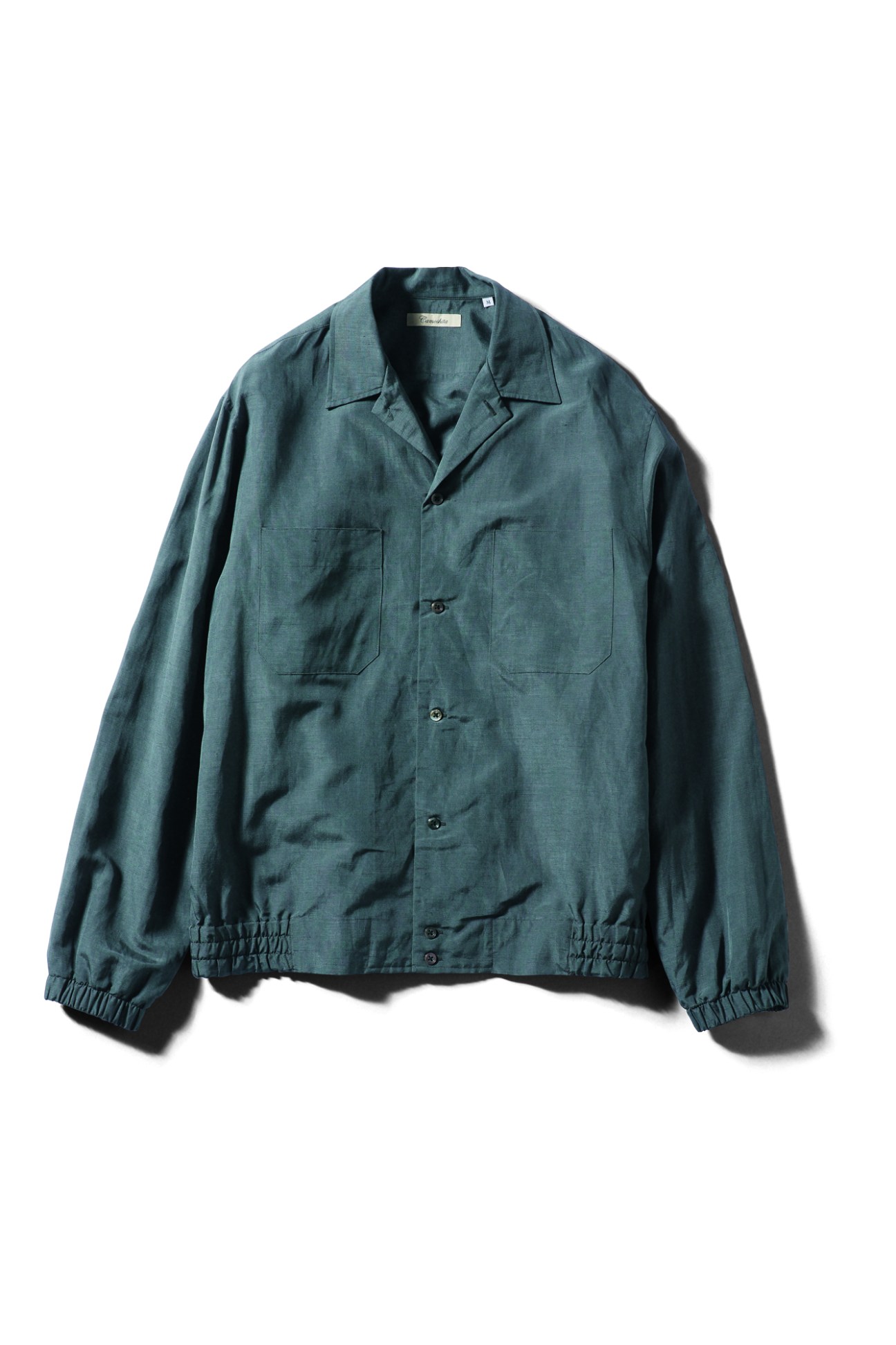 Dark green jacket with notched collar, chest pockets, and elastic cuffs by Camoshita United Arrows