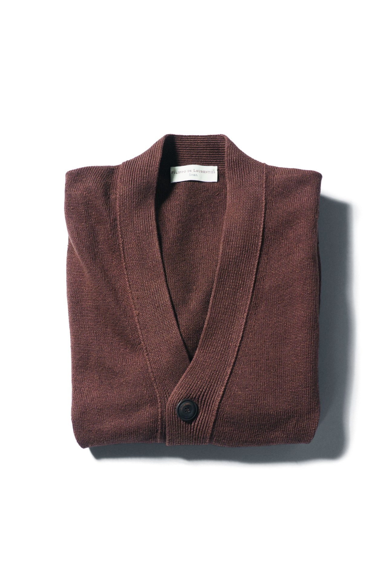 Brown ribbed cardigan by Filippo De Laurentiis with single button closure folded on white background