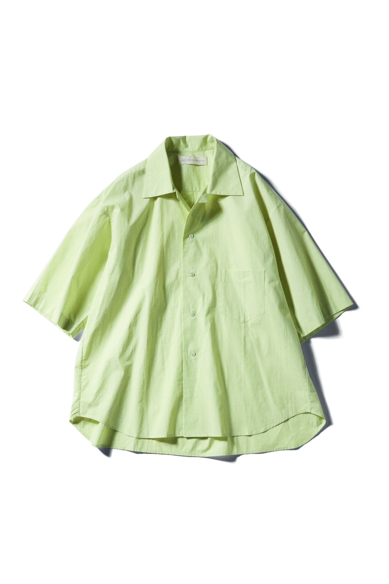 Light green short-sleeve button-up shirt by Jan Machenhauer displayed against white background