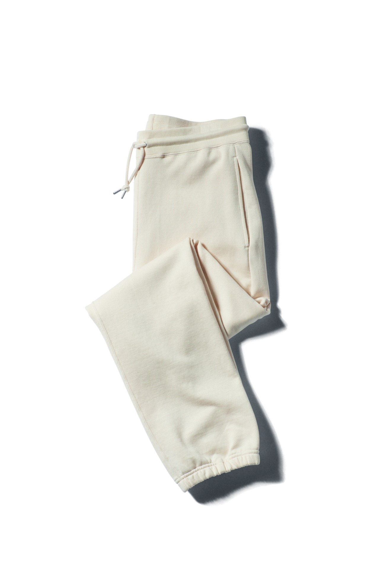 Cream colored sweatpants by Lifill with drawstring waist and elastic cuffs