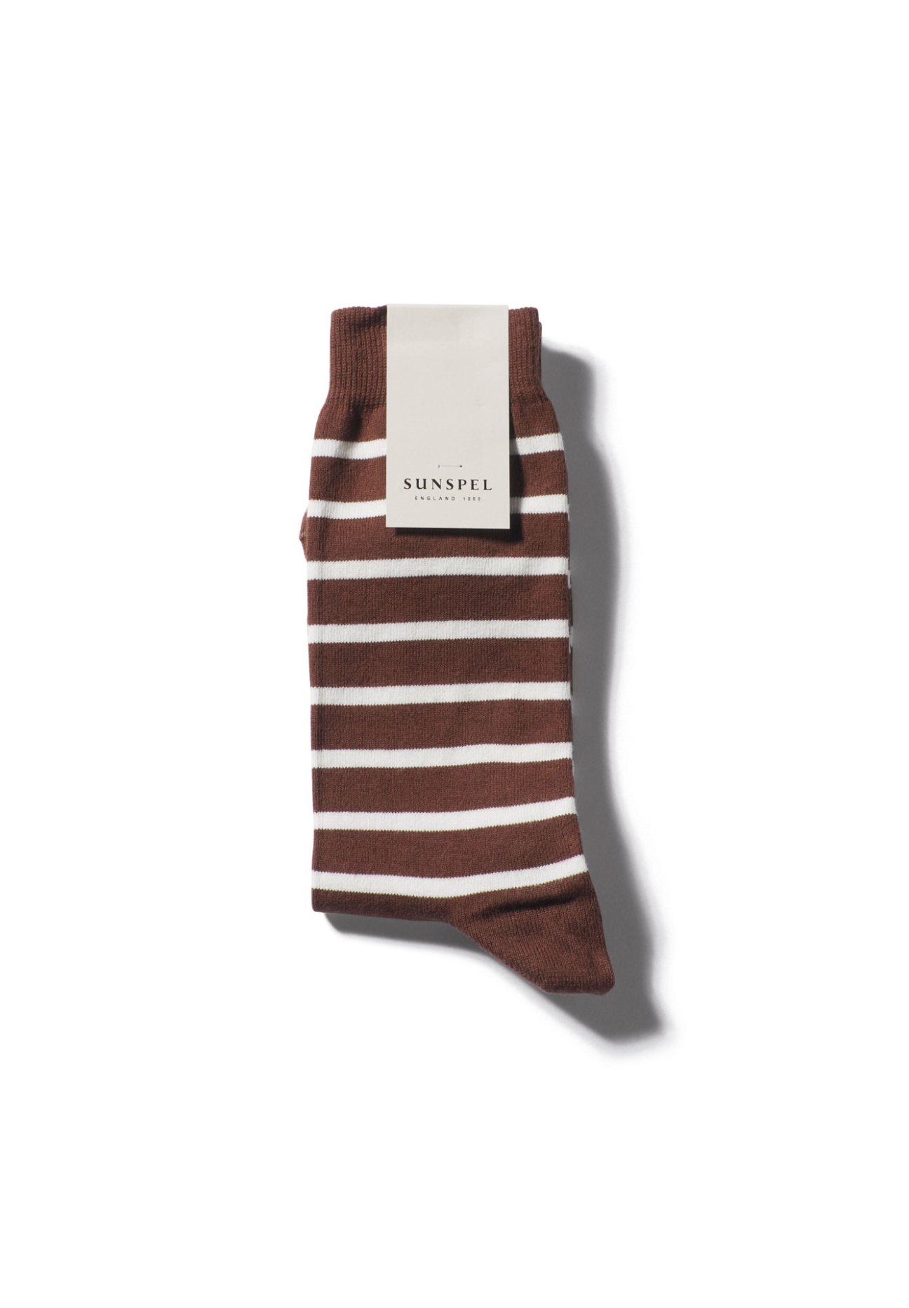 Brown and white striped socks by Sunspel with packaging label