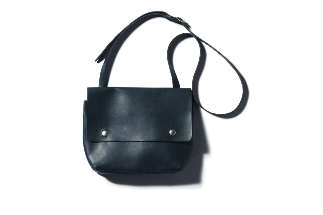 Black leather crossbody bag with adjustable strap and metal snap closure by MHL