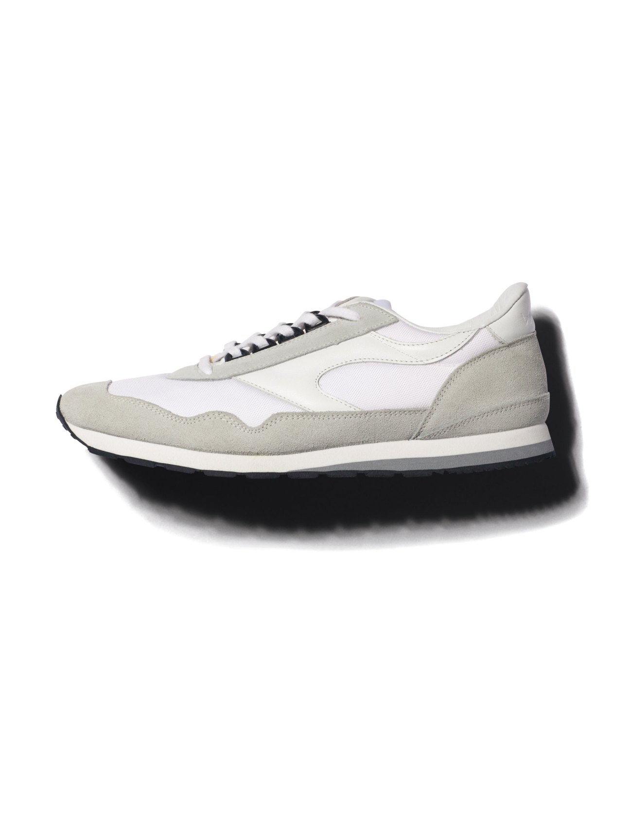 Gray and white running sneakers by Walsh from Sunspel Omotesando
