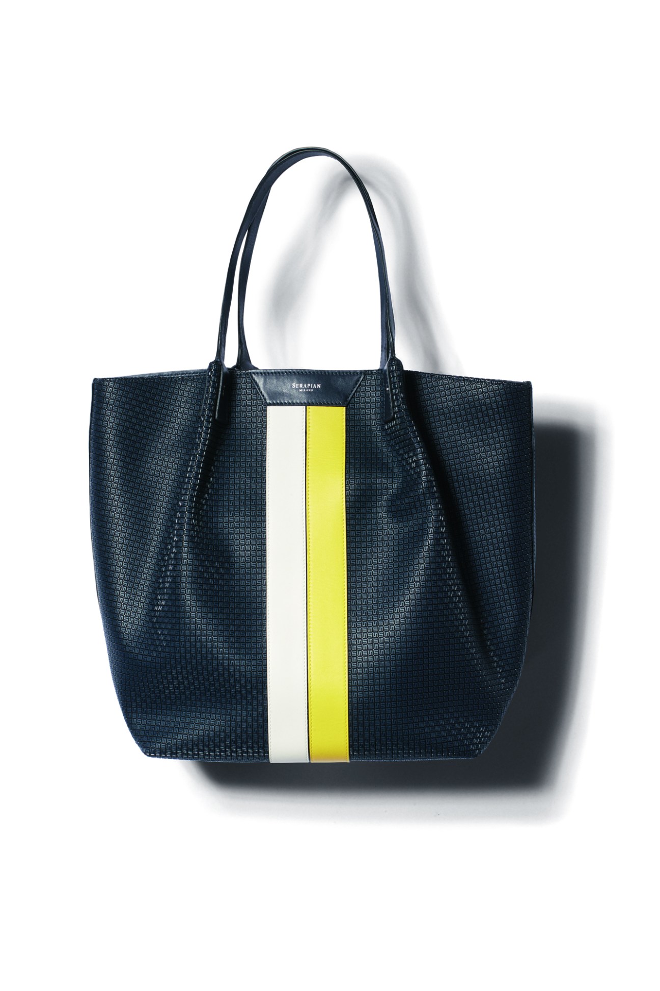 Navy blue textured leather tote bag by Serapian with white and yellow vertical stripe detail