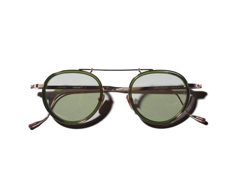 Green-tinted aviator sunglasses with metal bridge and tortoiseshell temples by Jacques Marie Mage