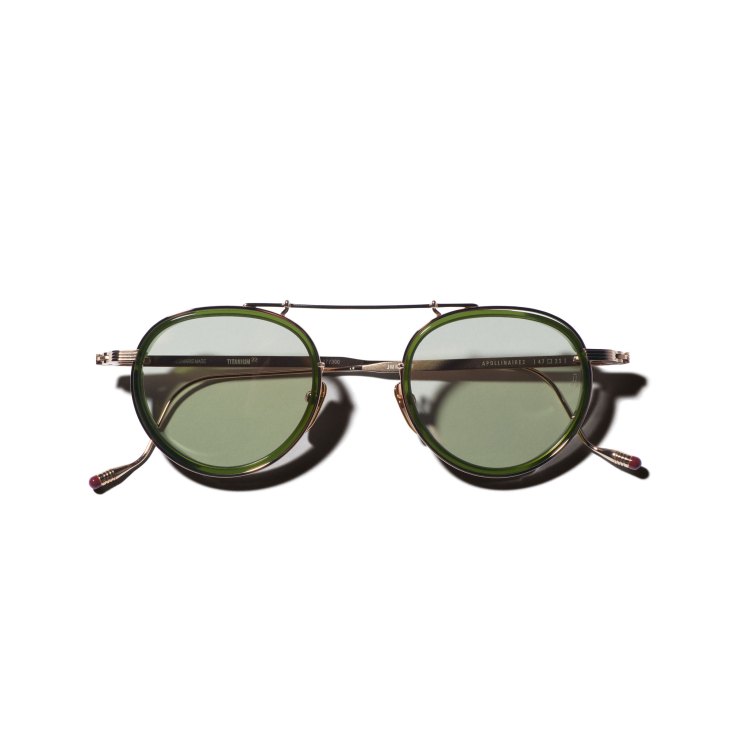 Green-tinted aviator sunglasses with metal bridge and tortoiseshell temples by Jacques Marie Mage