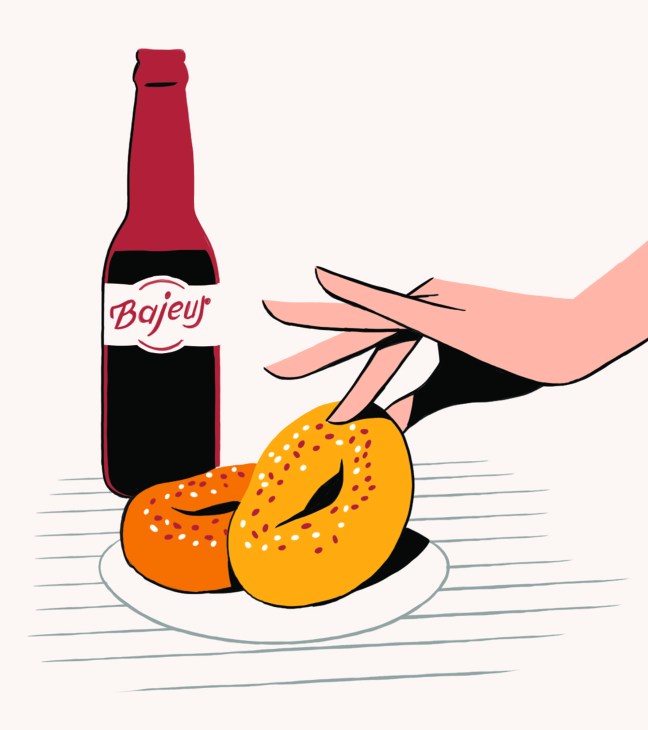 Illustration of a hand holding a Bafeur beer bottle above two bagels on a plate.