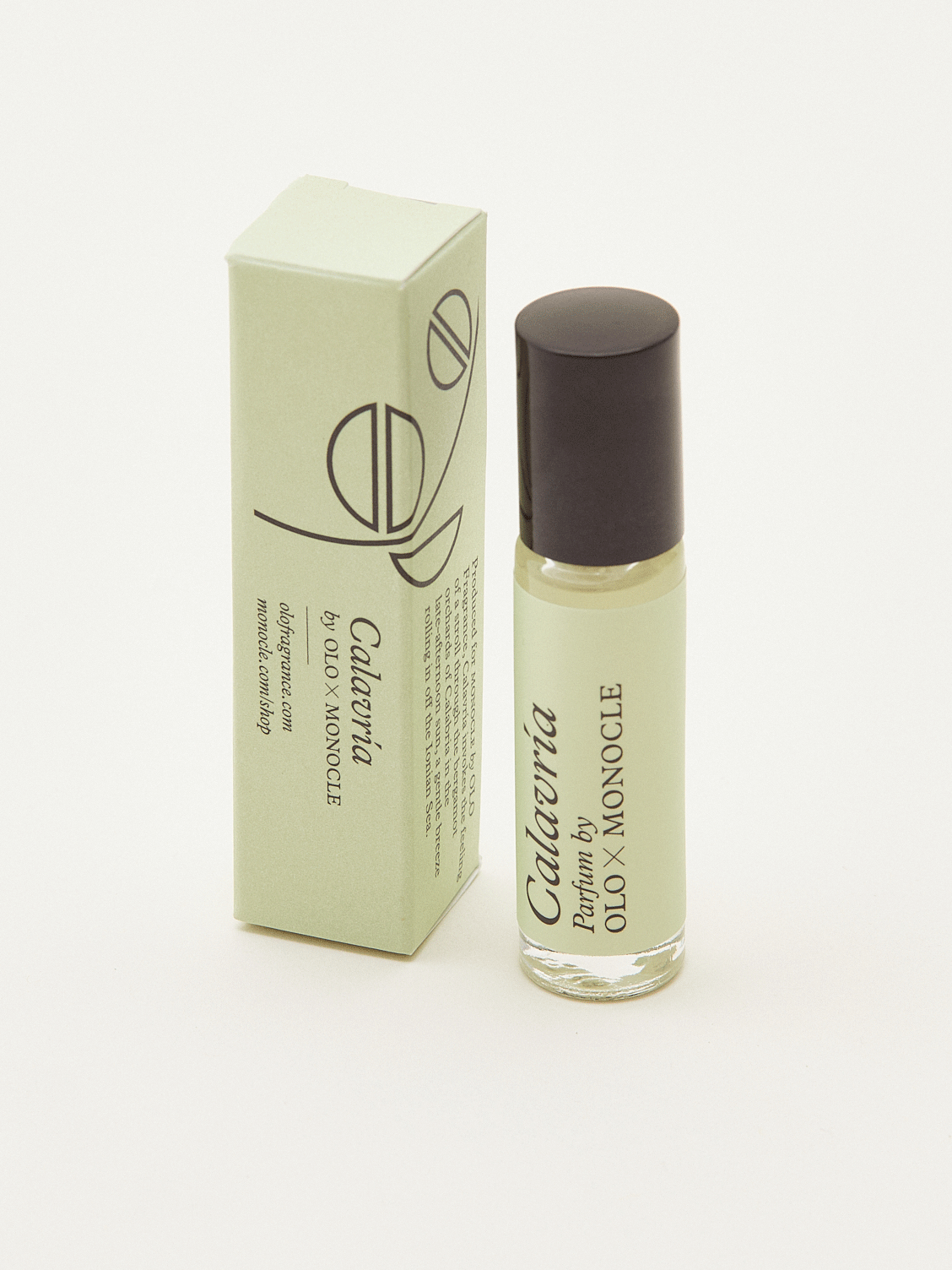 OLO x Monocle Calavria roll-on fragrance bottle with pale green packaging and dark brown cap